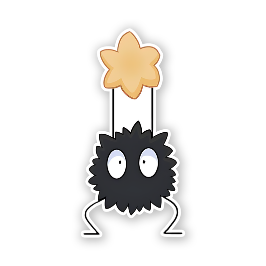 Susuwatari, or soot sprite, holding a star-shaped candy from the Studio Ghibli film Spirited Away Sticker